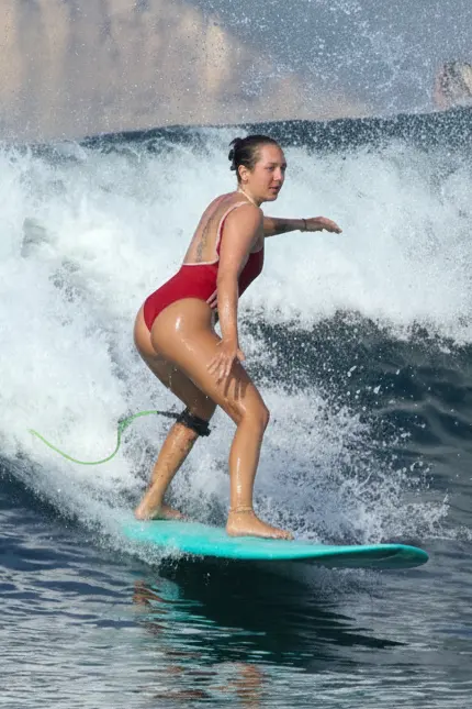 Surfer riding a wave in Lombok
